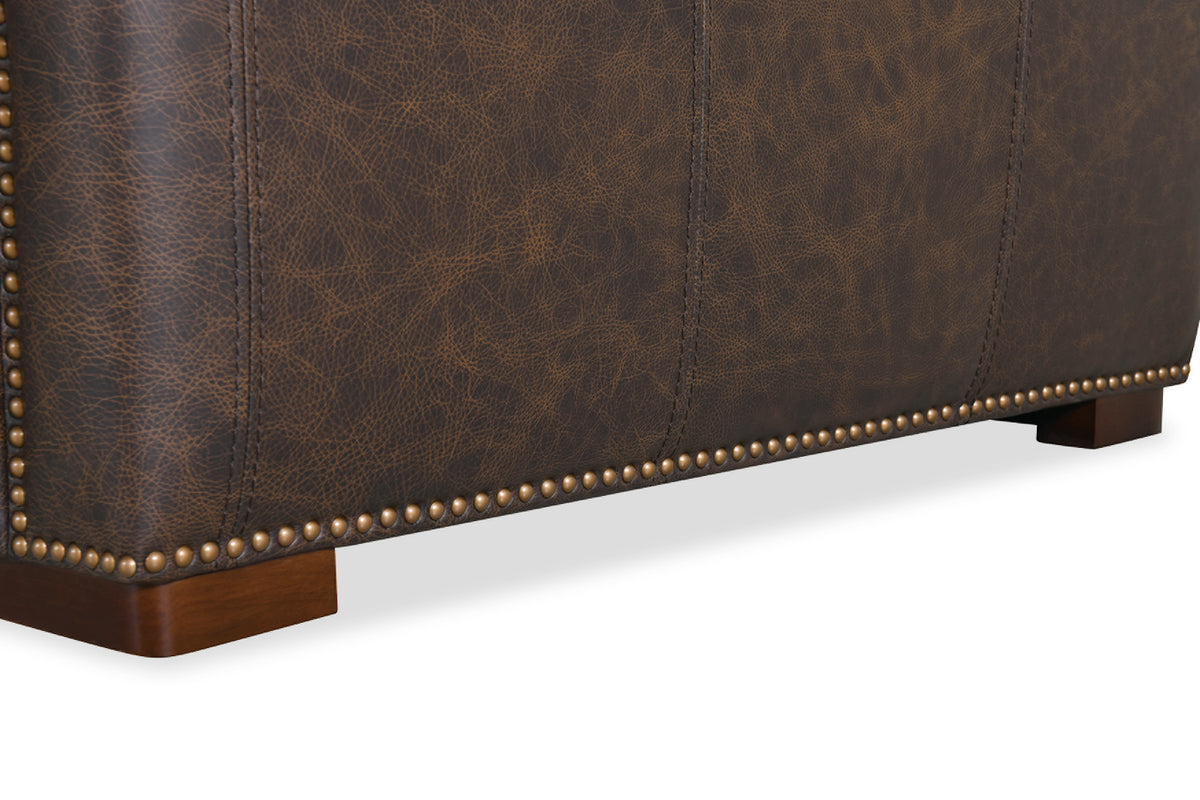 a close up of a brown leather couch