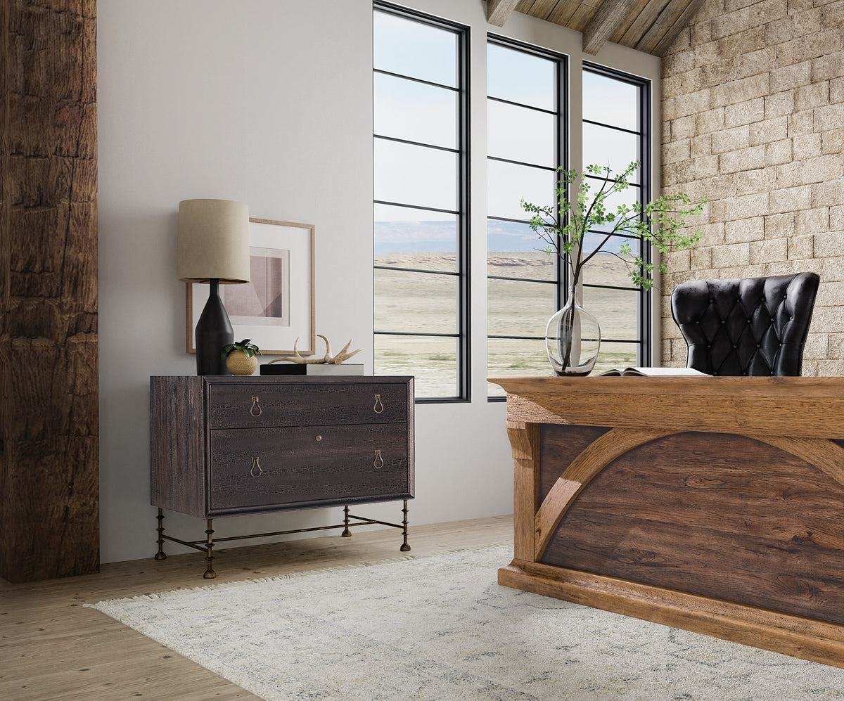 a room with a desk and a dresser