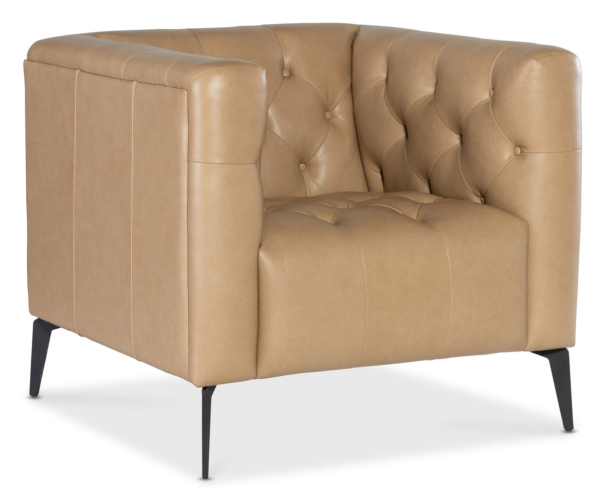 a tan leather chair with black legs