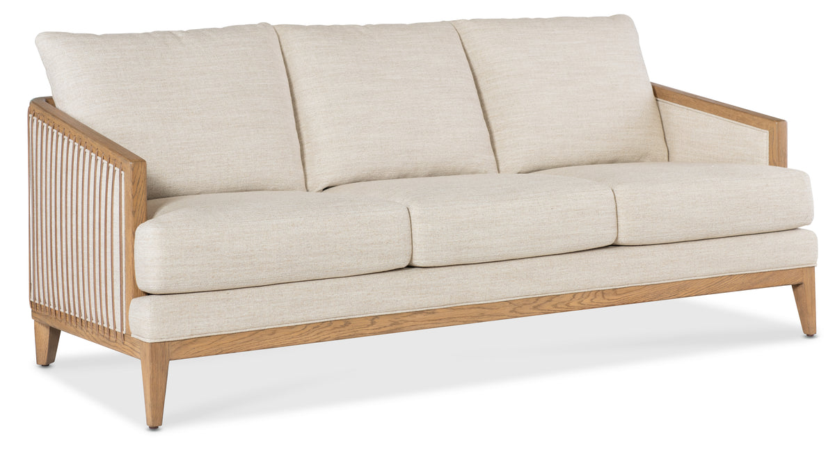 a white couch with pillows