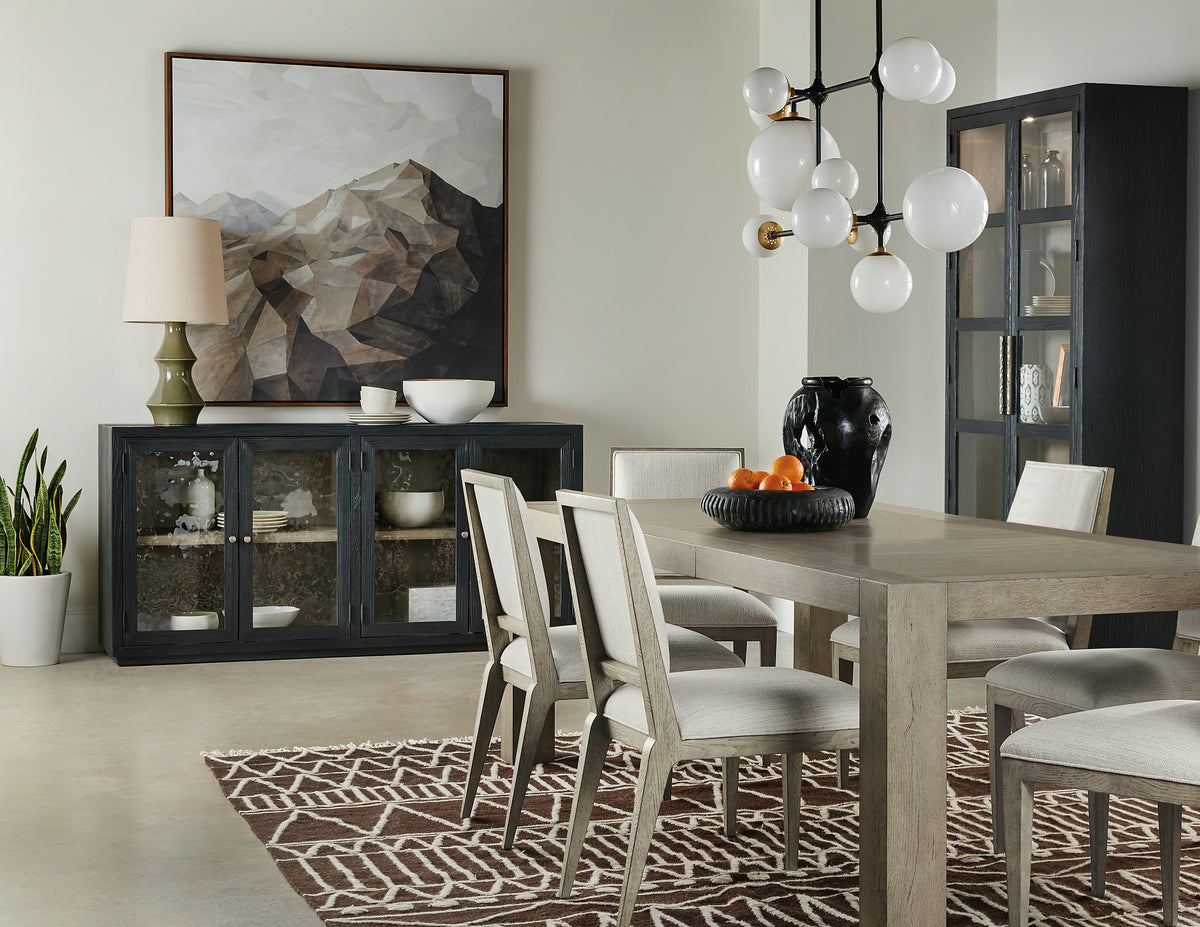a dining room with a table and chairs