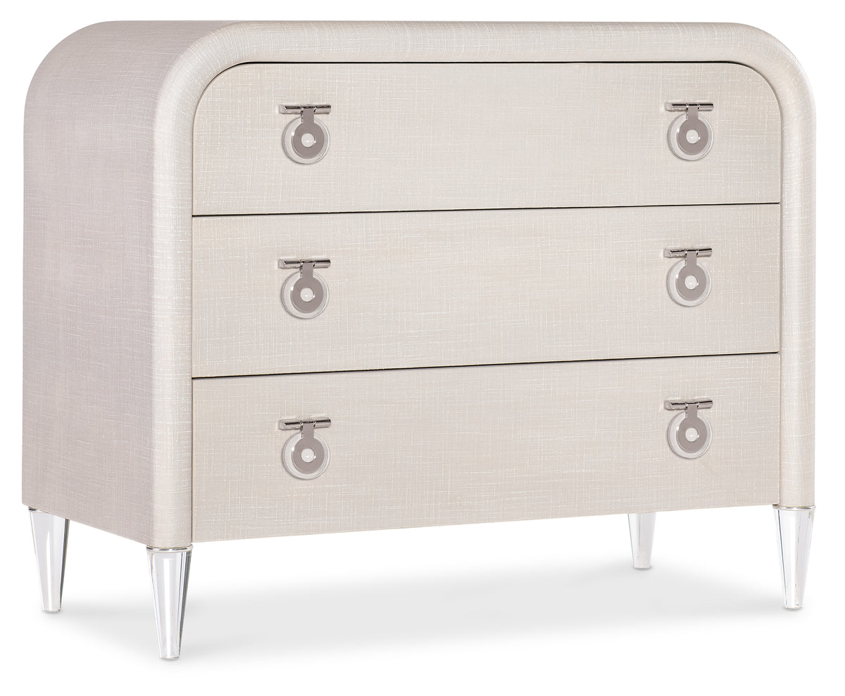 a white dresser with silver handles