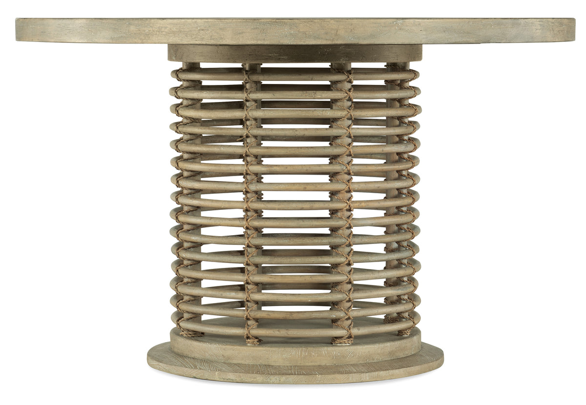 a round wooden table with a round top