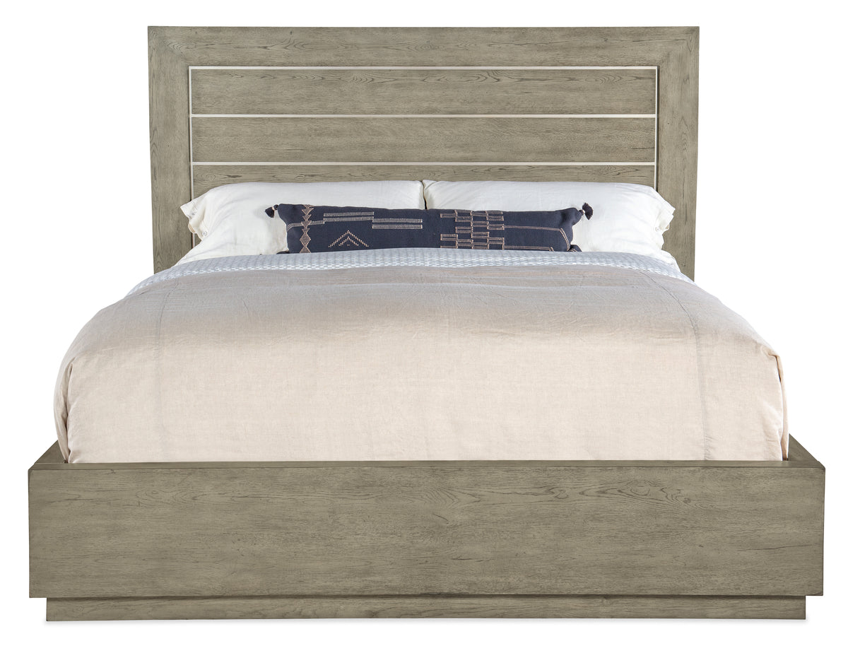 a bed with a white blanket and pillows