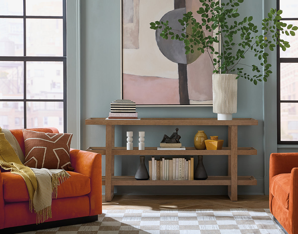 a living room with a painting on the wall