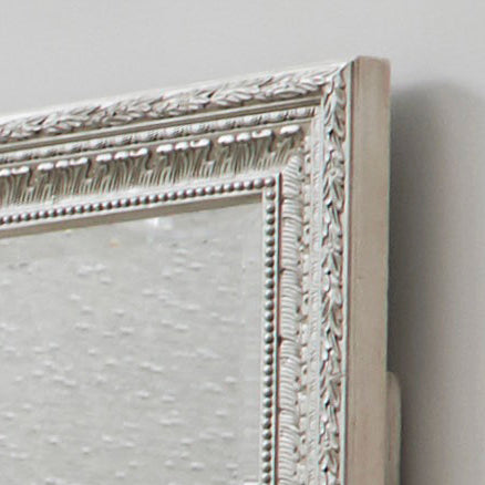 a white frame on a wall