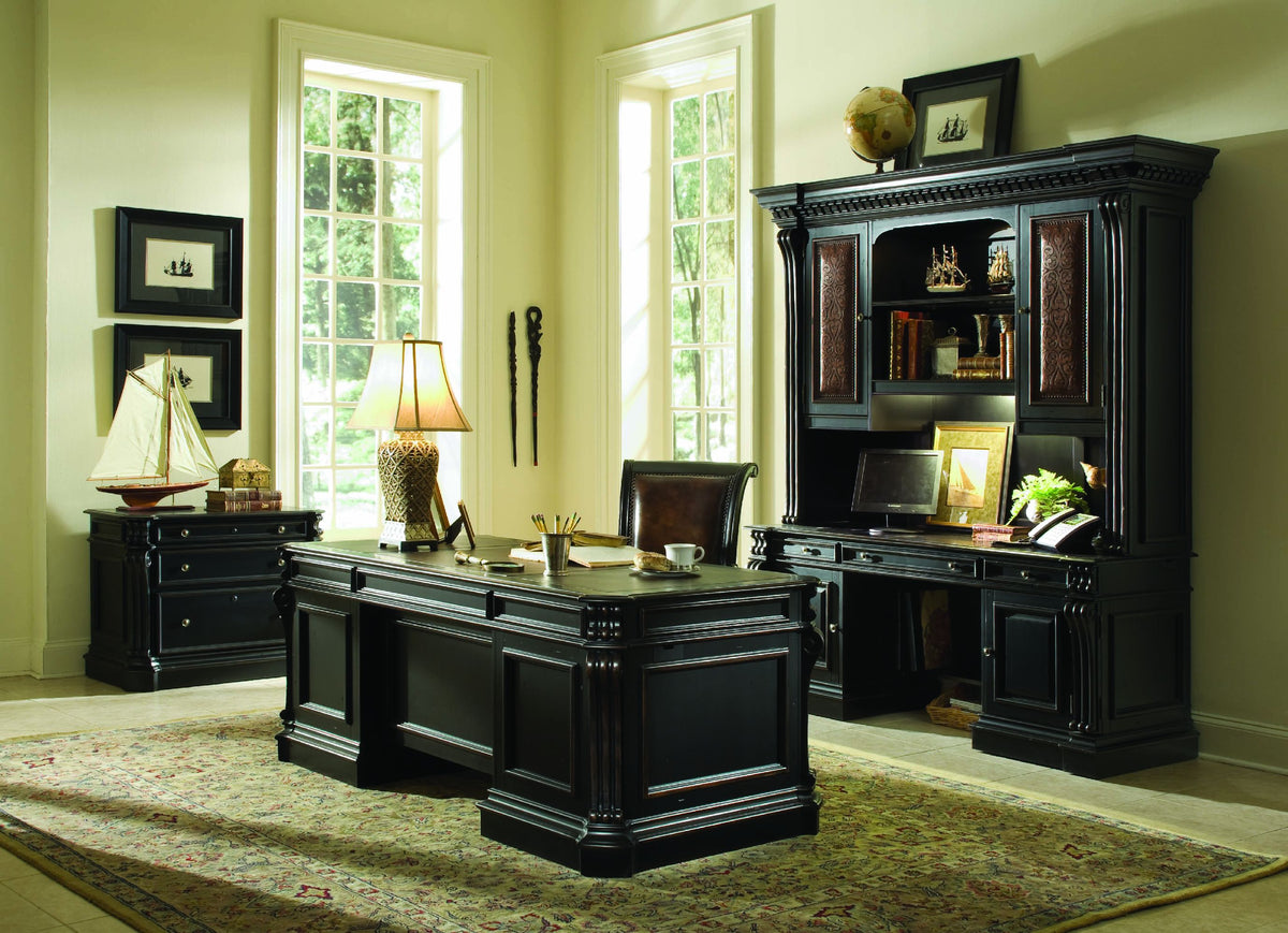 a room with a desk and a bookcase