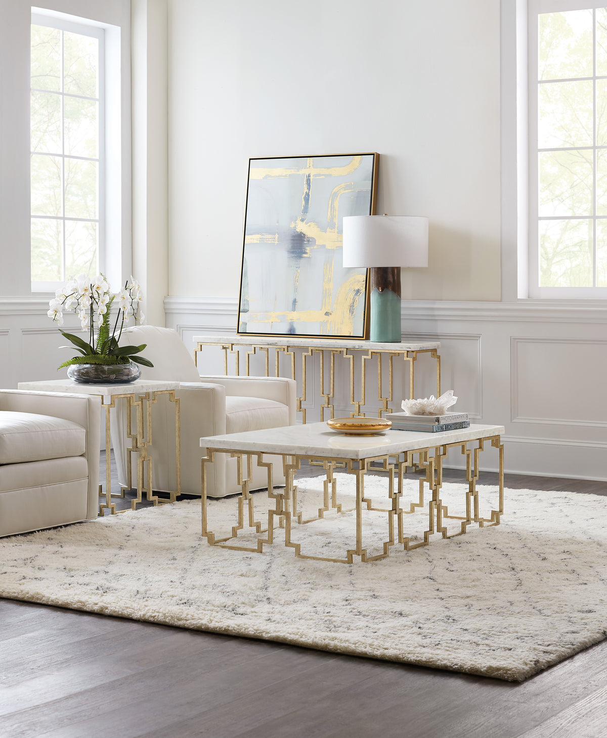 a living room with white furniture and white walls