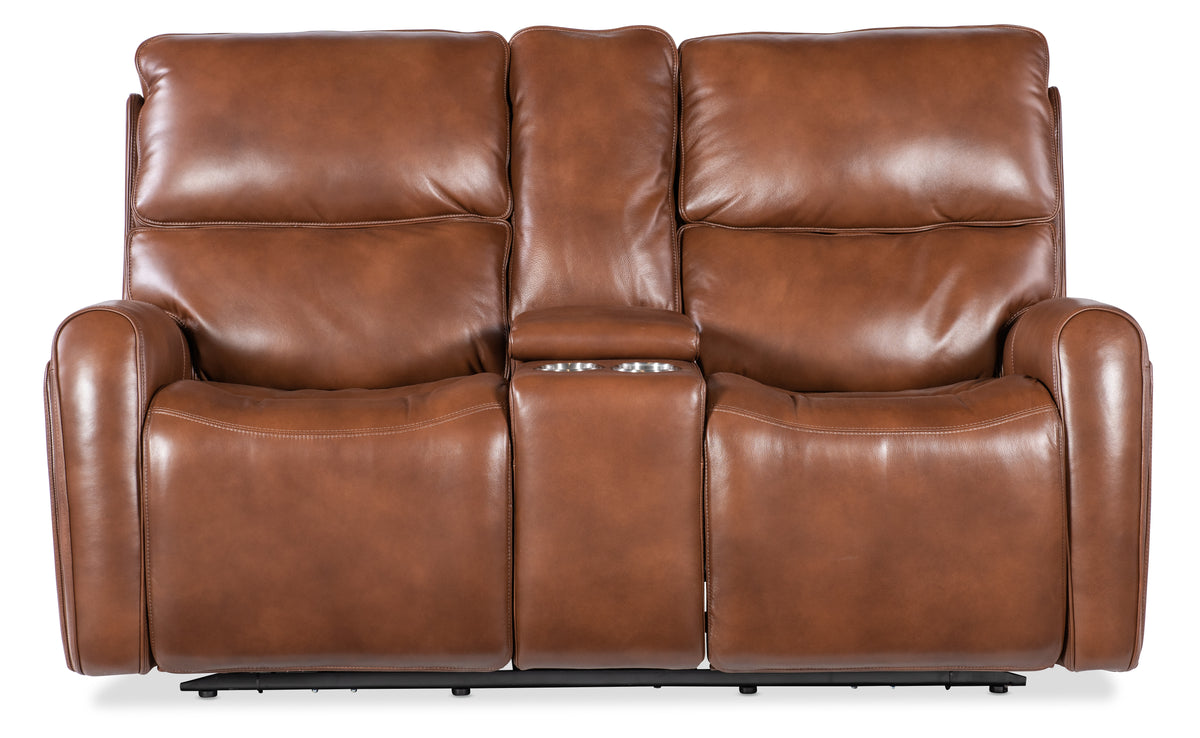 a brown leather couch with two reclining seats