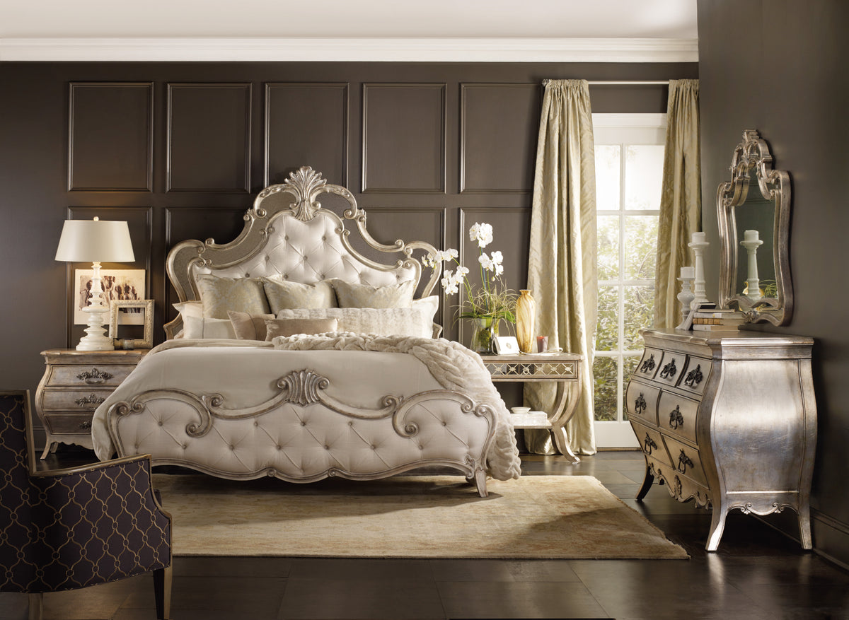 a bedroom with a bed and dresser