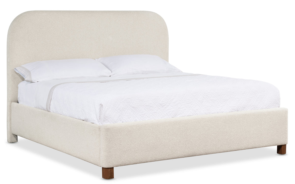 a bed with a white headboard