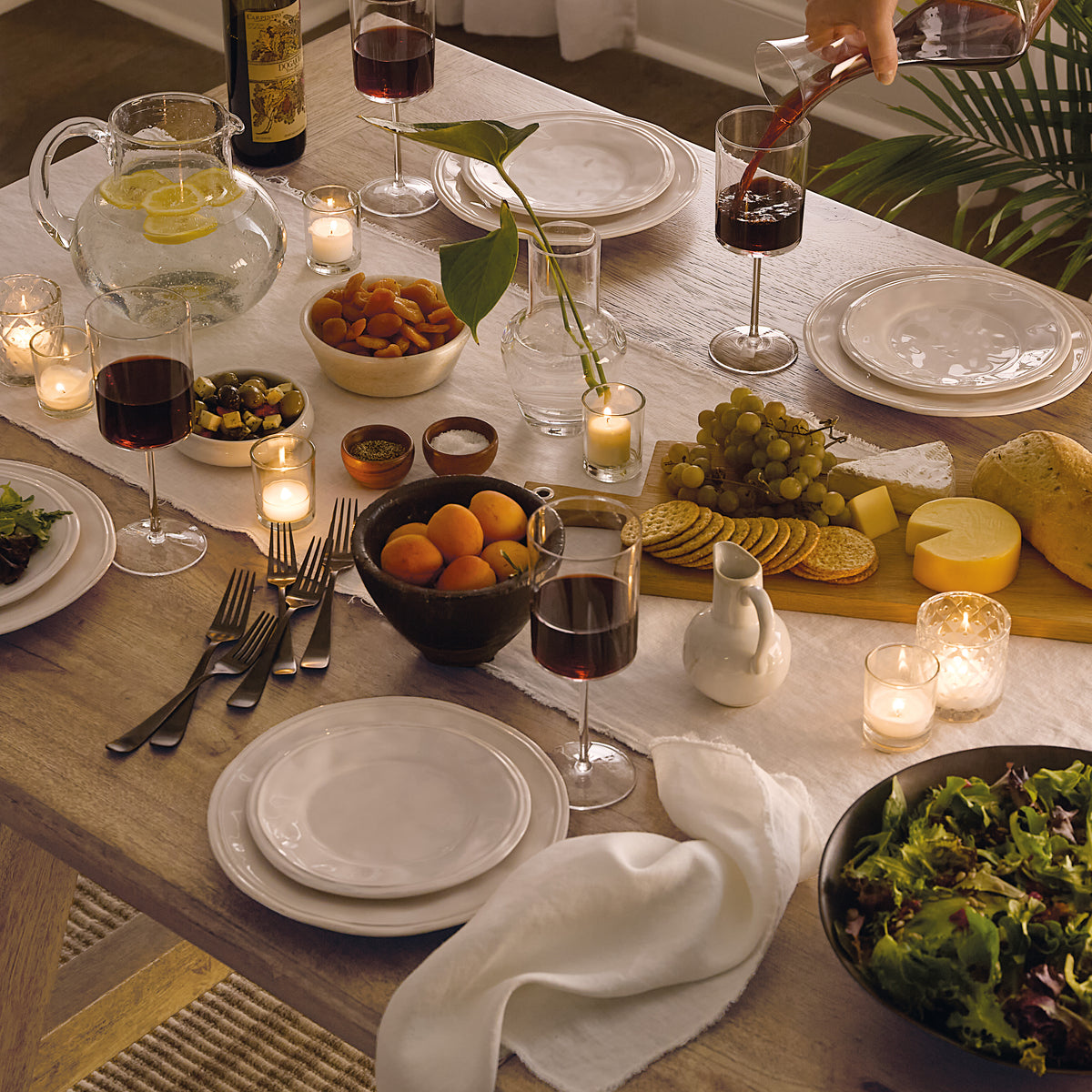a table with food and wine glasses