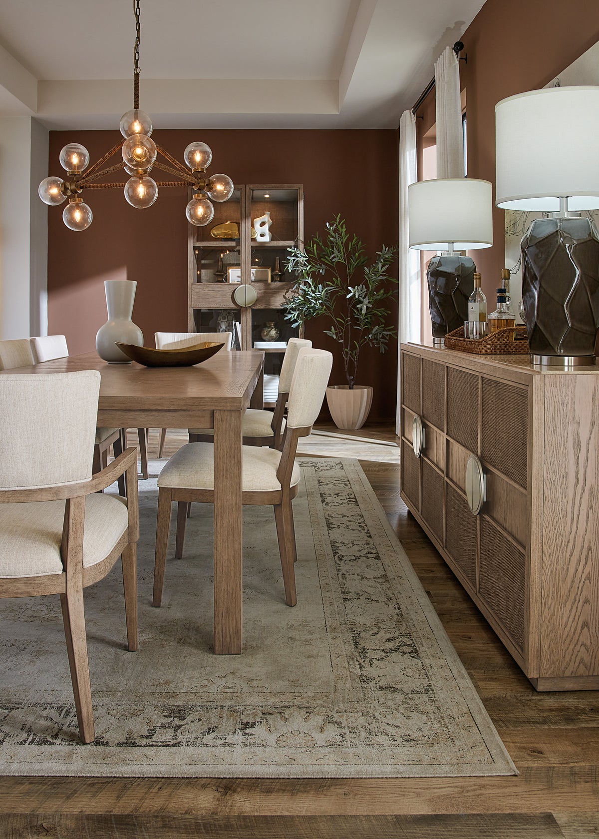 a dining room with a table and chairs