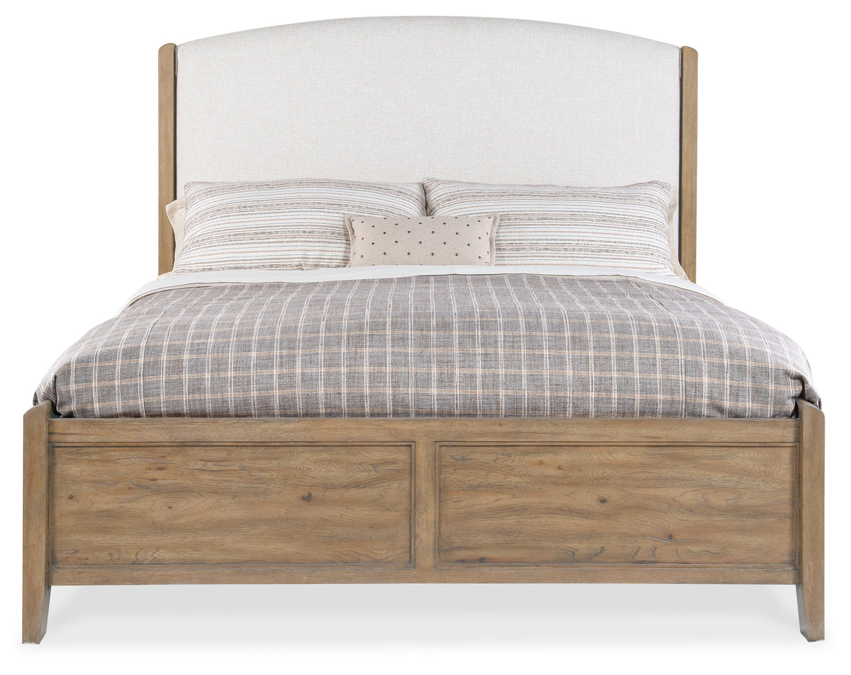 a bed with a white headboard