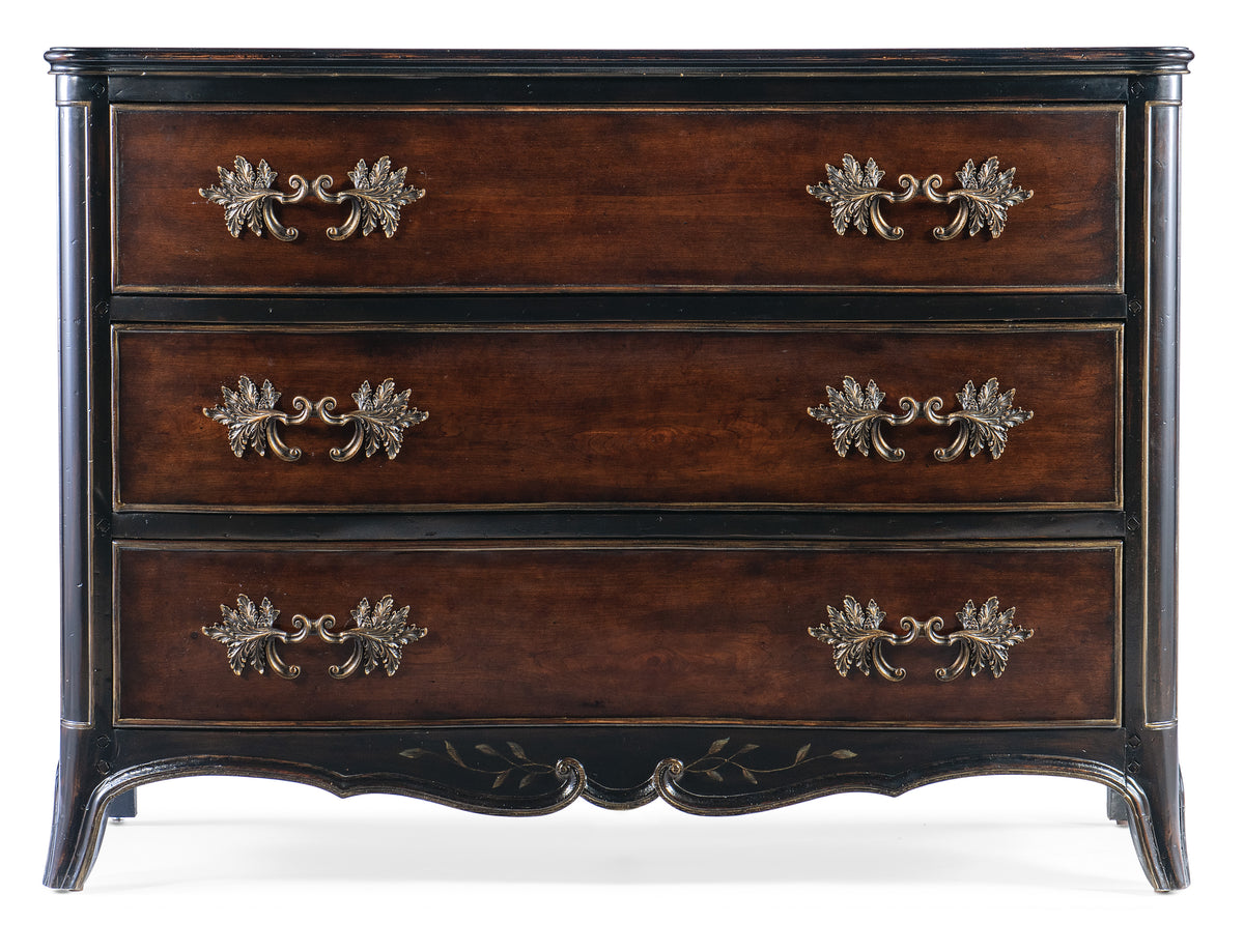 a brown dresser with gold handles