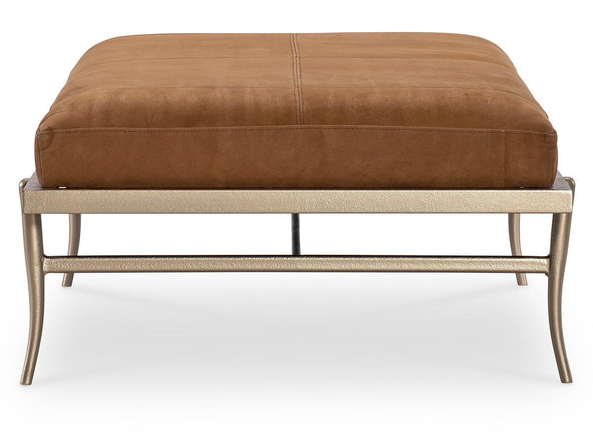 a brown ottoman with a silver base