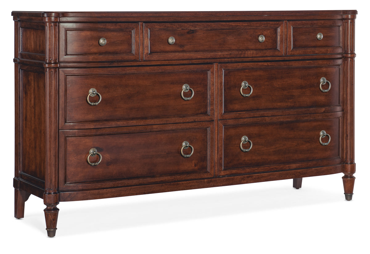a brown dresser with gold handles