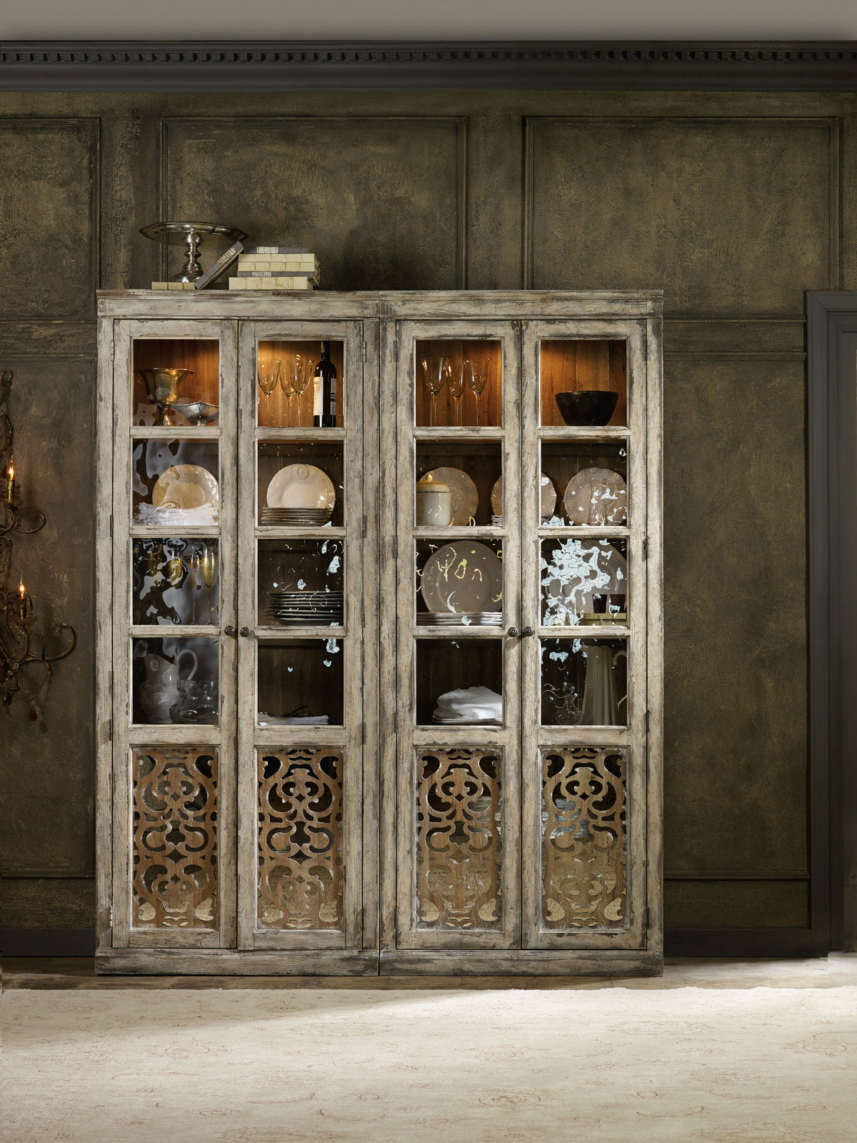 a wooden cabinet with plates and plates on top