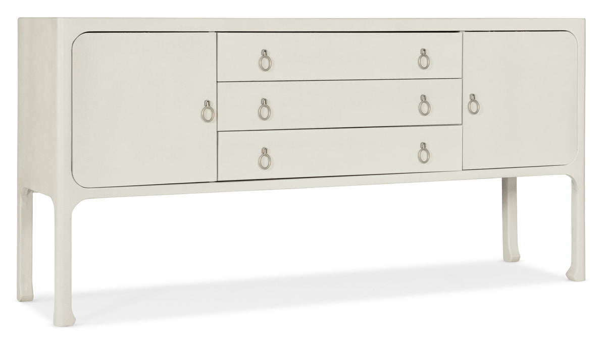 a white dresser with metal handles
