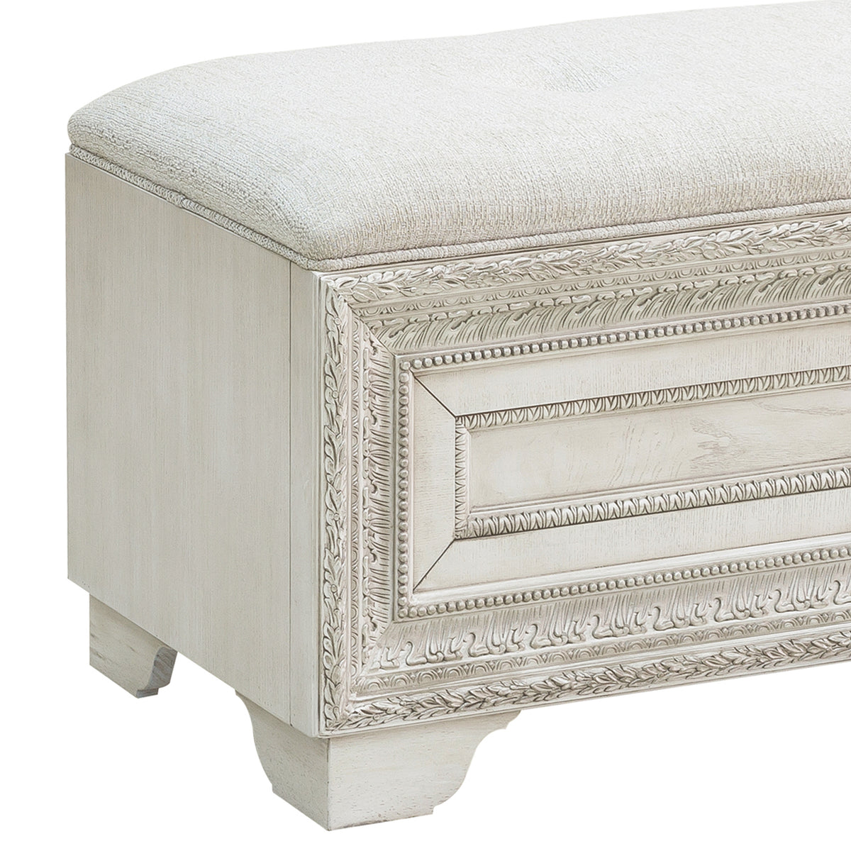 a white bench with a cushion