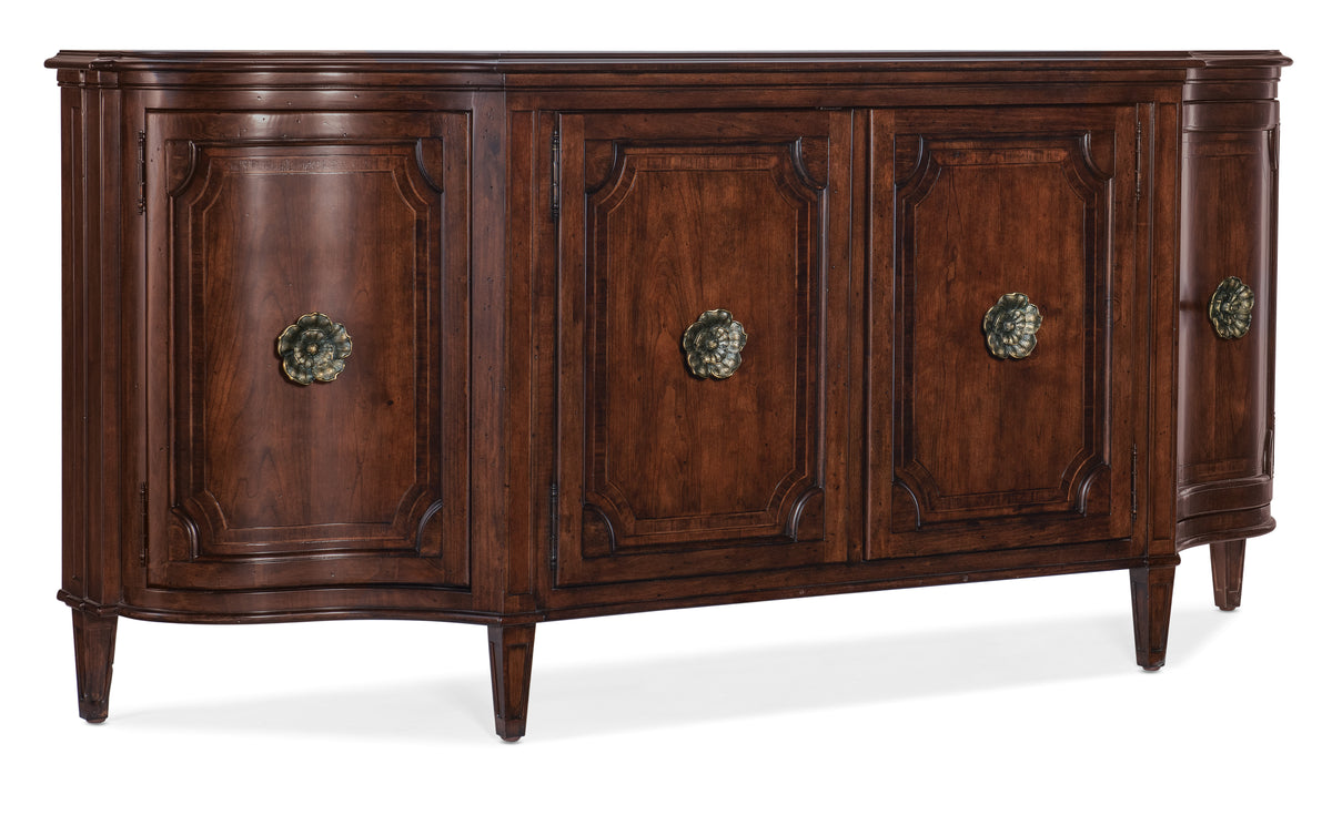 a brown wooden cabinet with gold handles