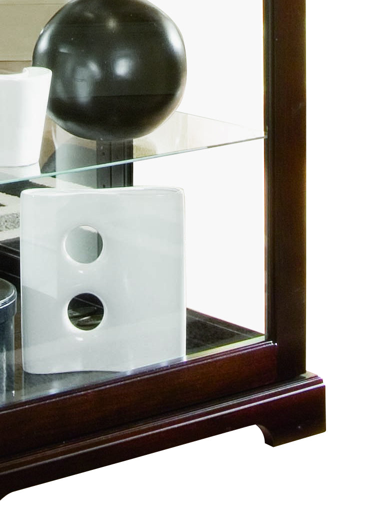 a white ceramic object on a glass shelf