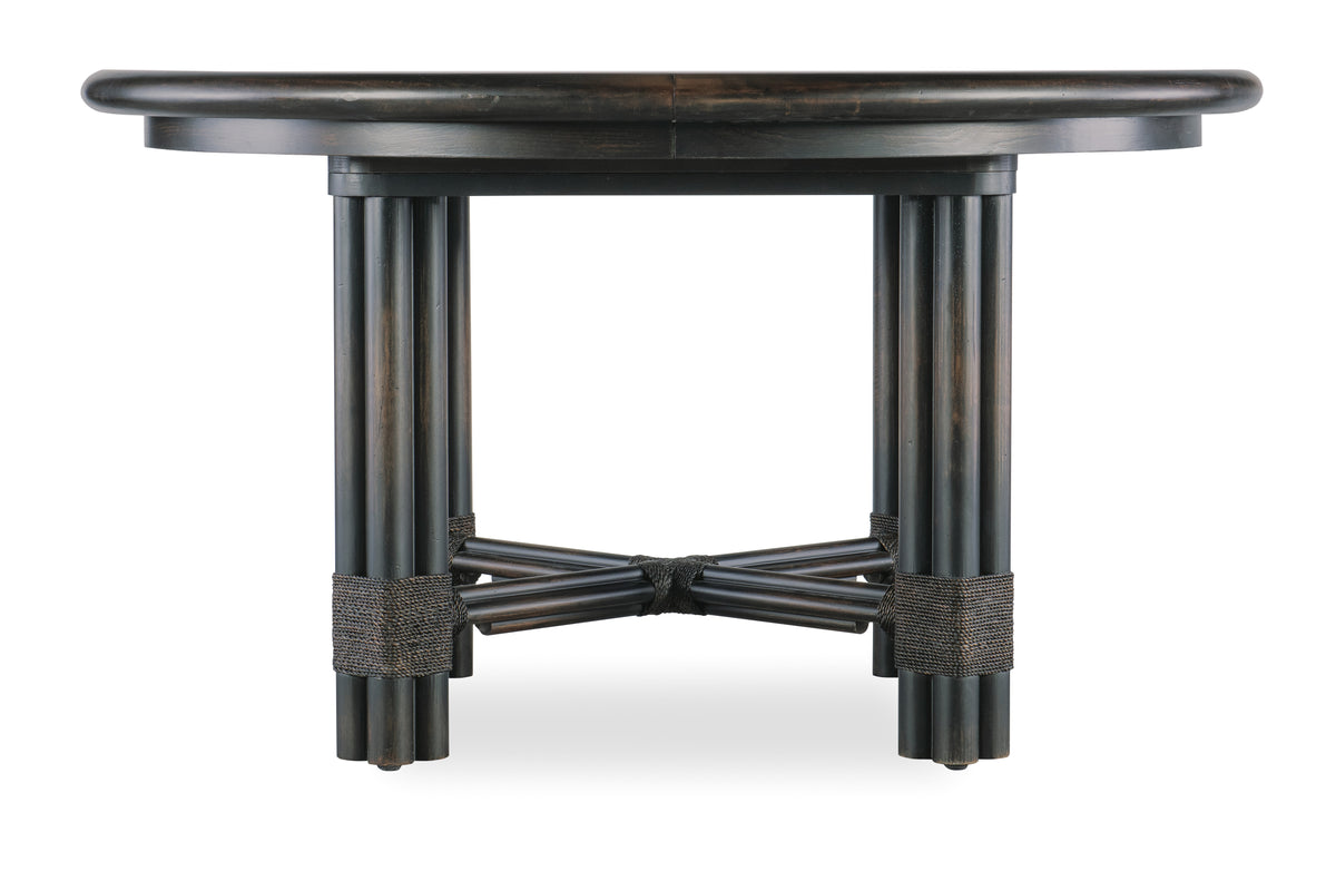 a round wooden table with a black base