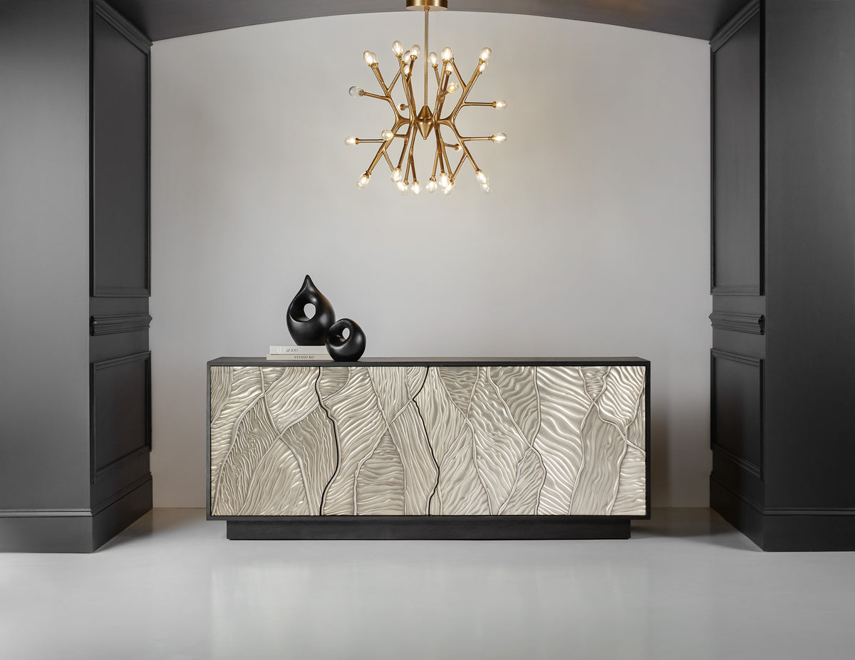 a chandelier over a cabinet