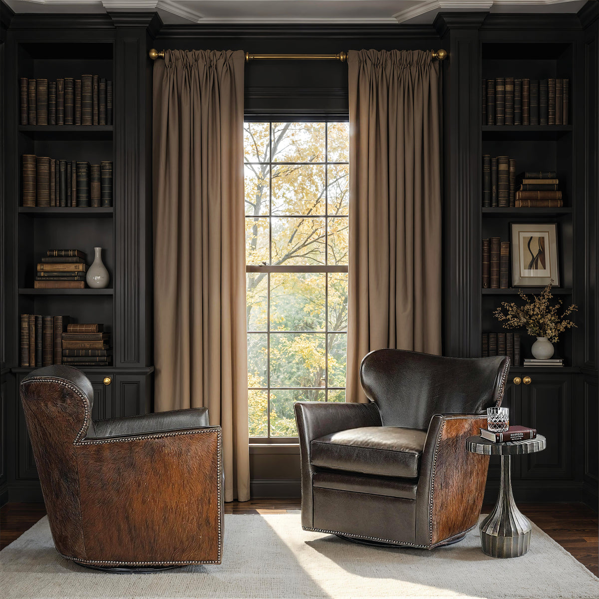 a chair in a room with bookshelves and a window