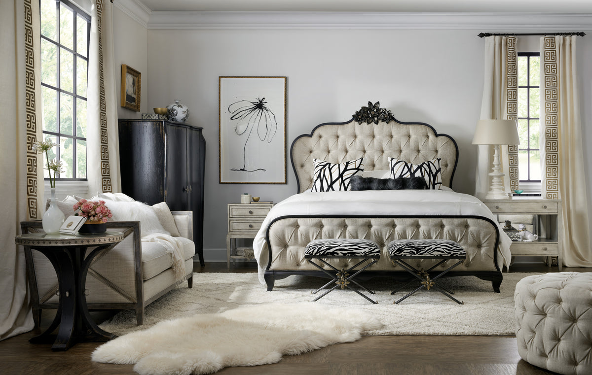 a bedroom with a bed and a chair