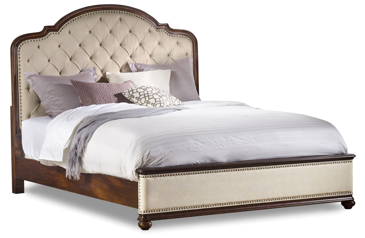 a bed with a white headboard