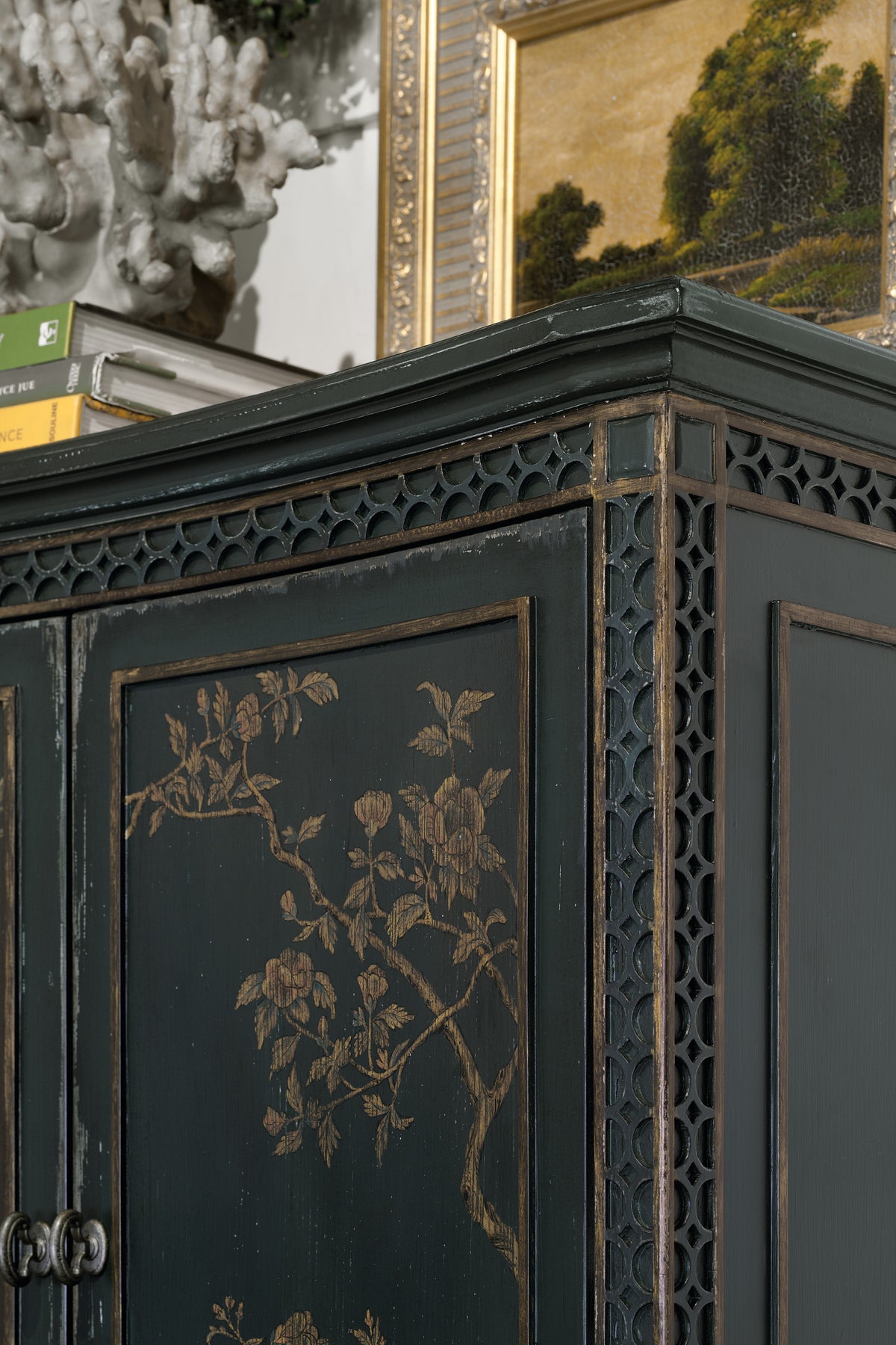 a black cabinet with gold designs