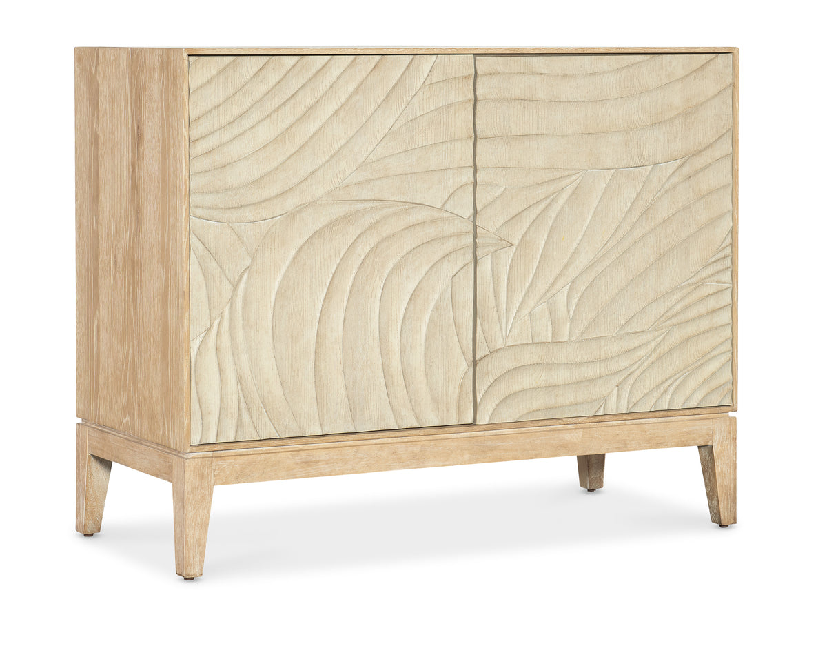 a white cabinet with a pattern on it