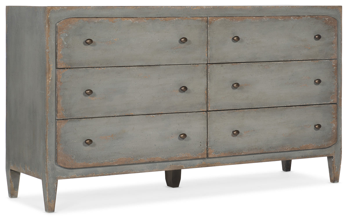 a grey dresser with drawers