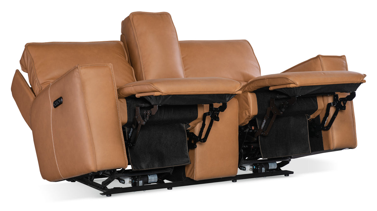 a brown leather couch with armrests