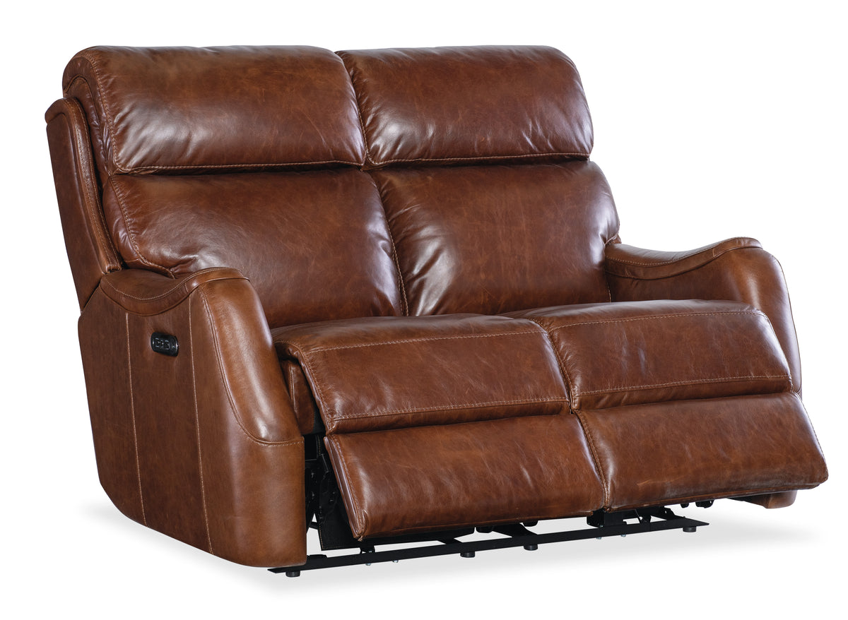 a brown leather recliner with a white background