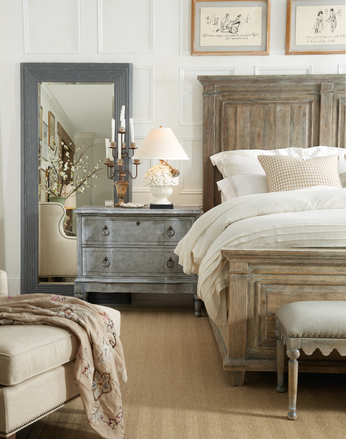 a bedroom with a mirror and a bed