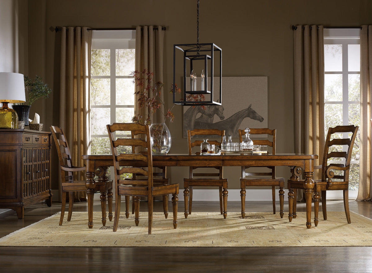 a dining room with a table and chairs