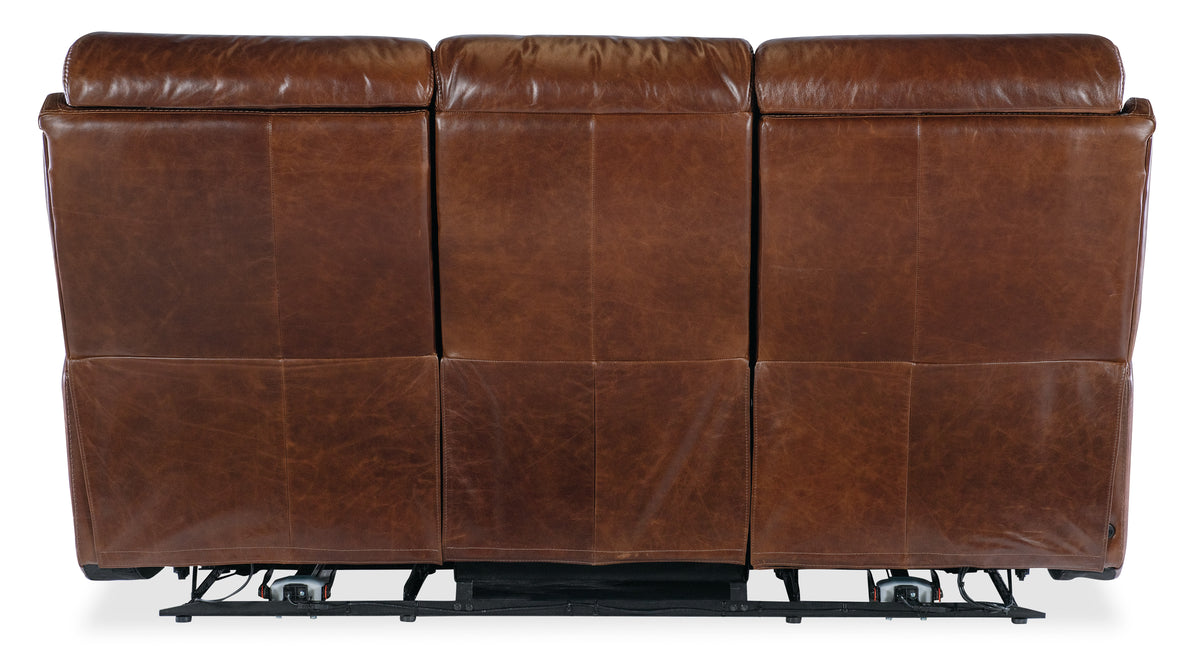 a brown leather couch with wheels