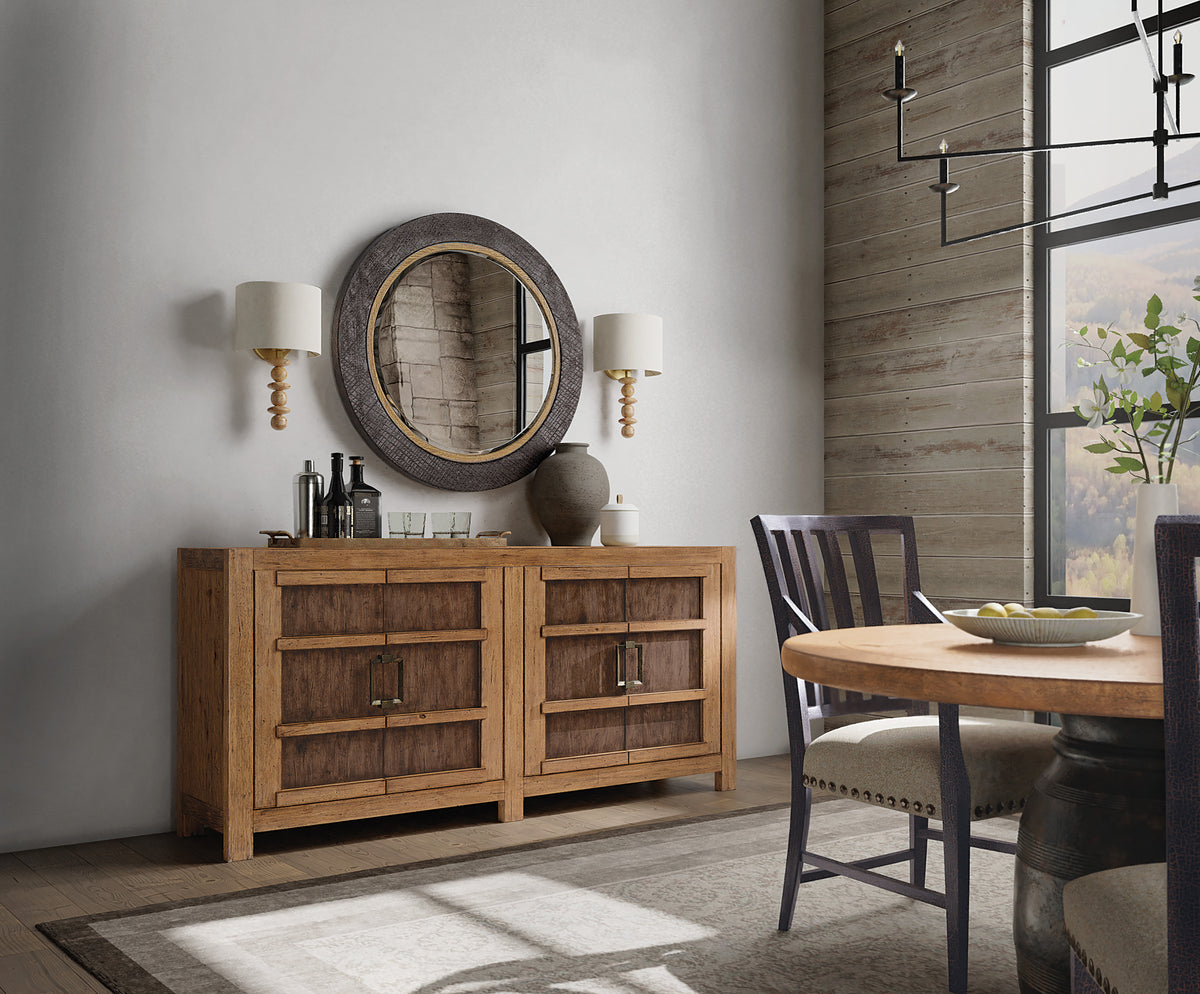 a dining room with a table and a mirror