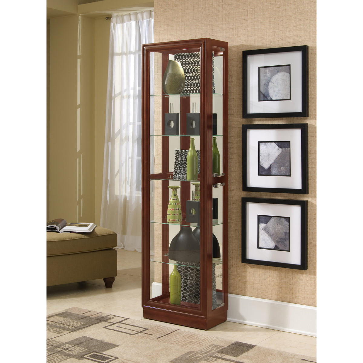 a glass cabinet with shelves and pictures on the wall