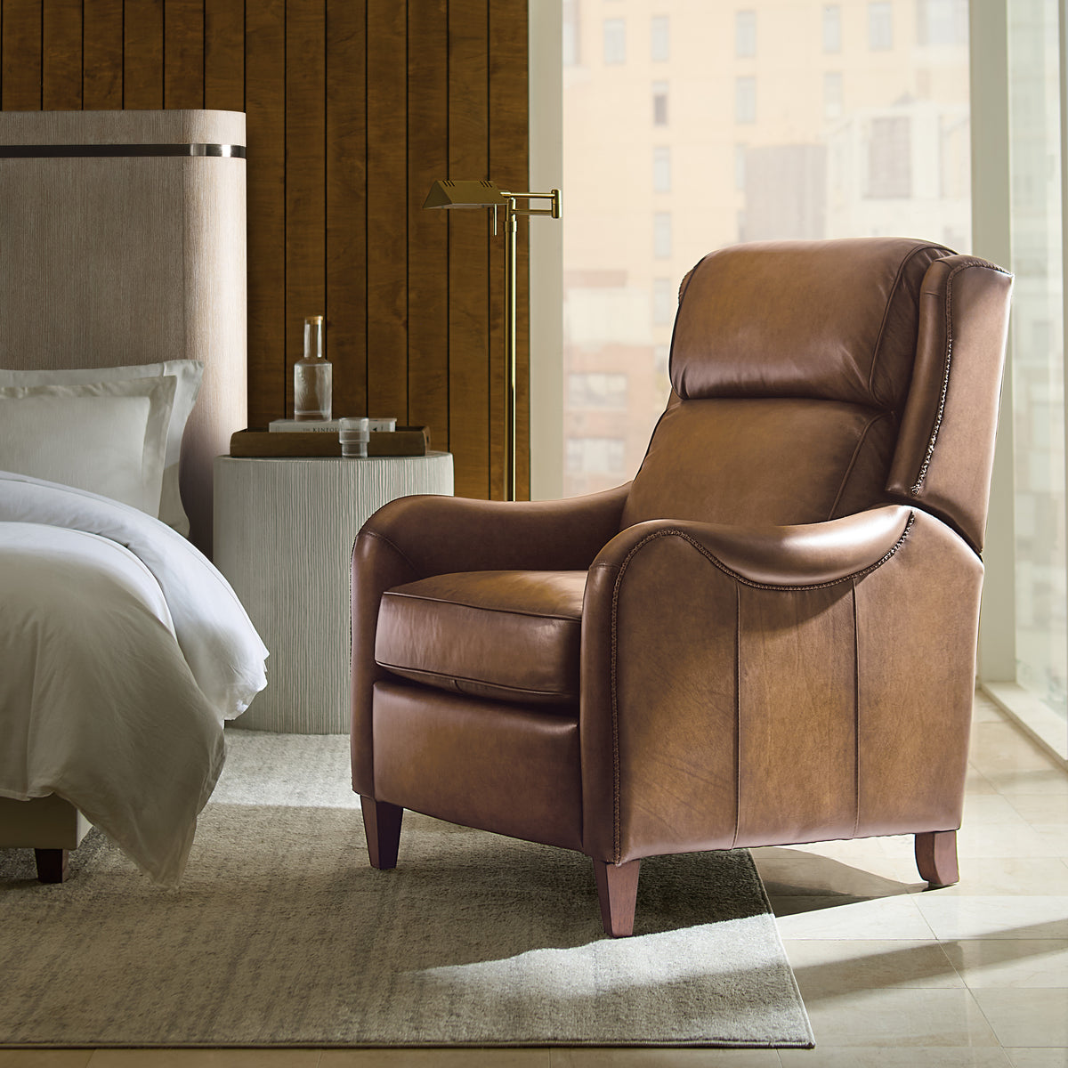 a brown leather chair in a room