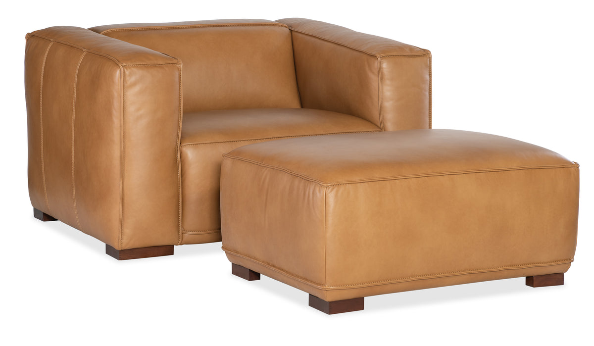 a brown leather chair and ottoman