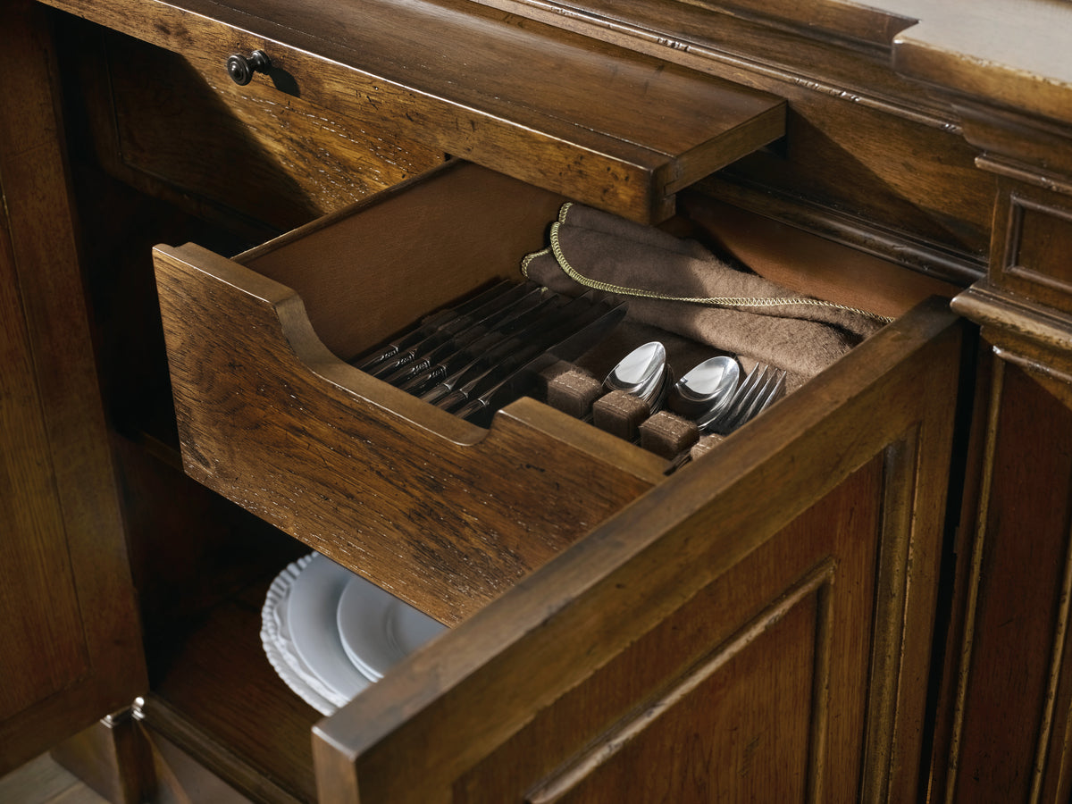 a drawer with silverware and plates