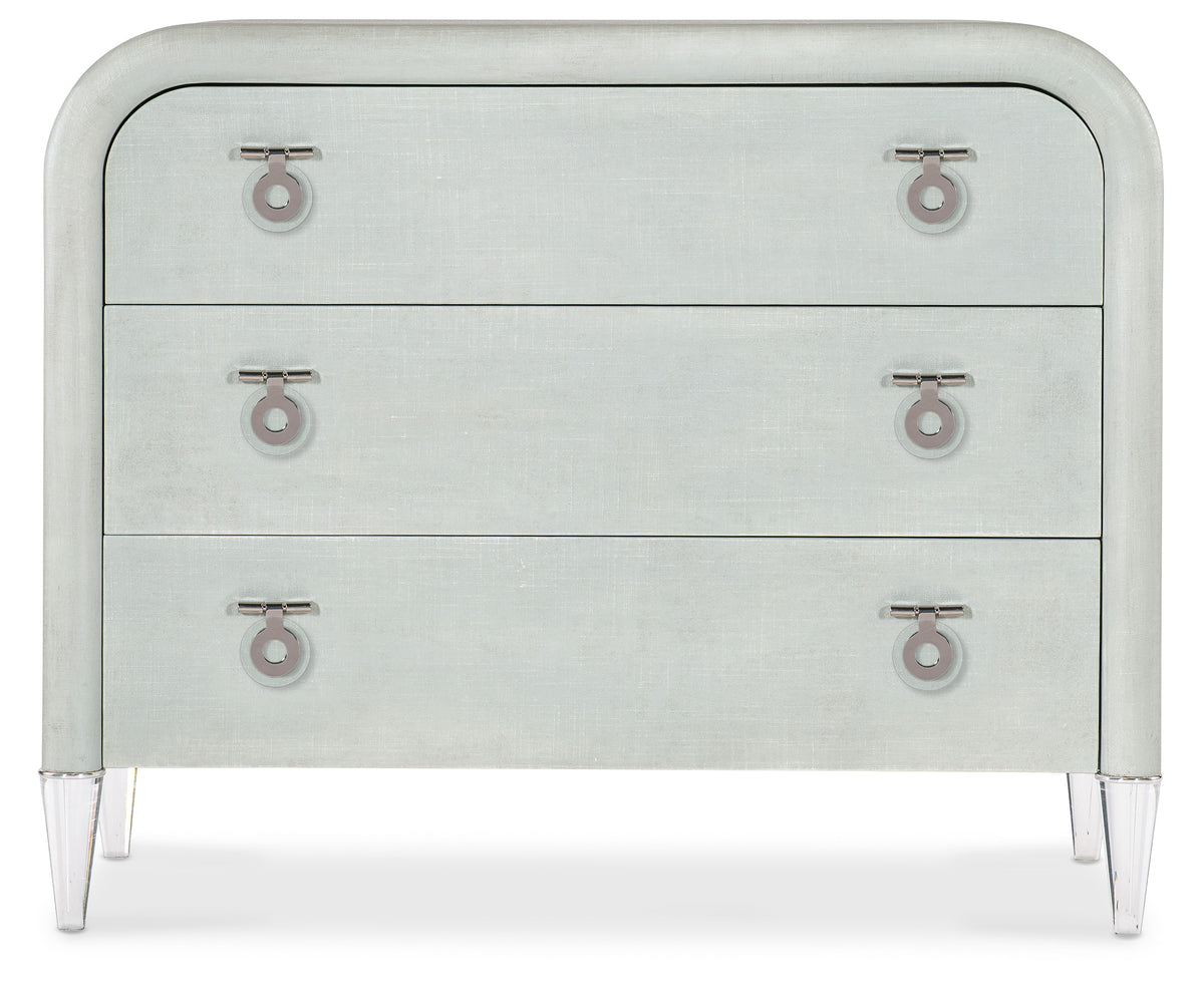 a white dresser with three drawers