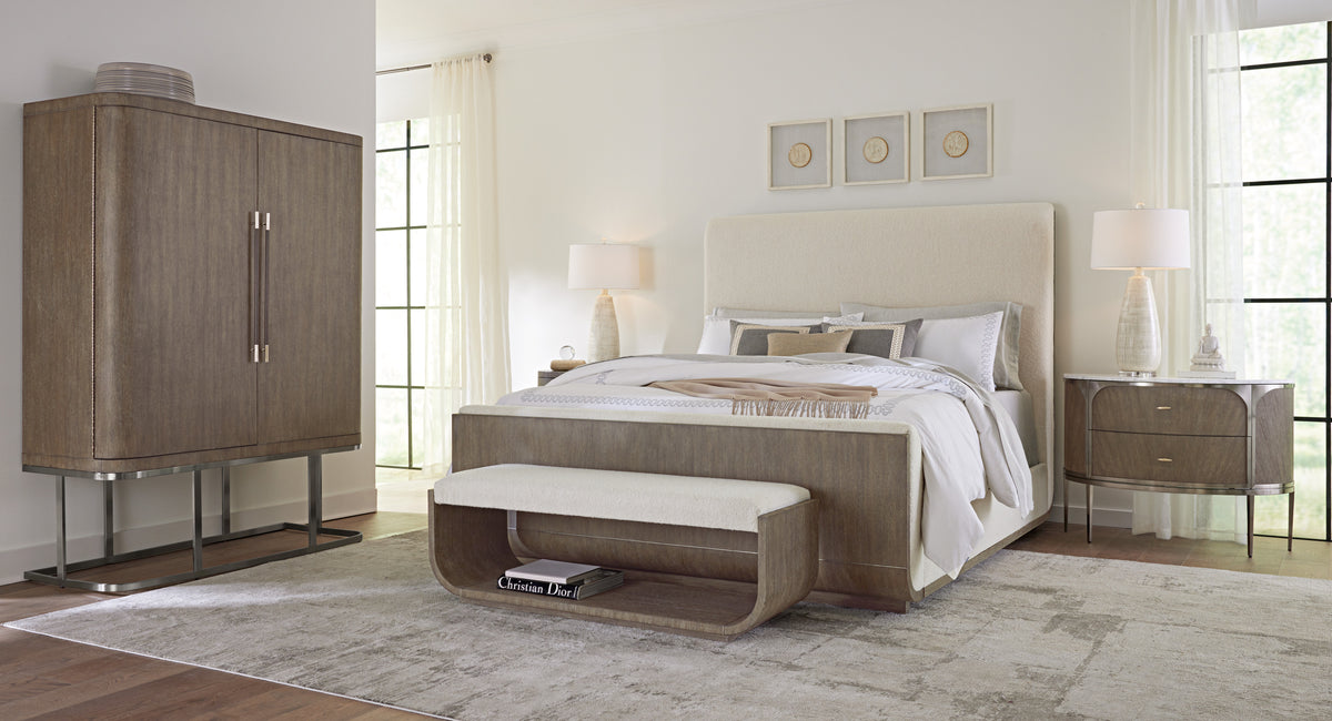 a bed with a bench and a lamp