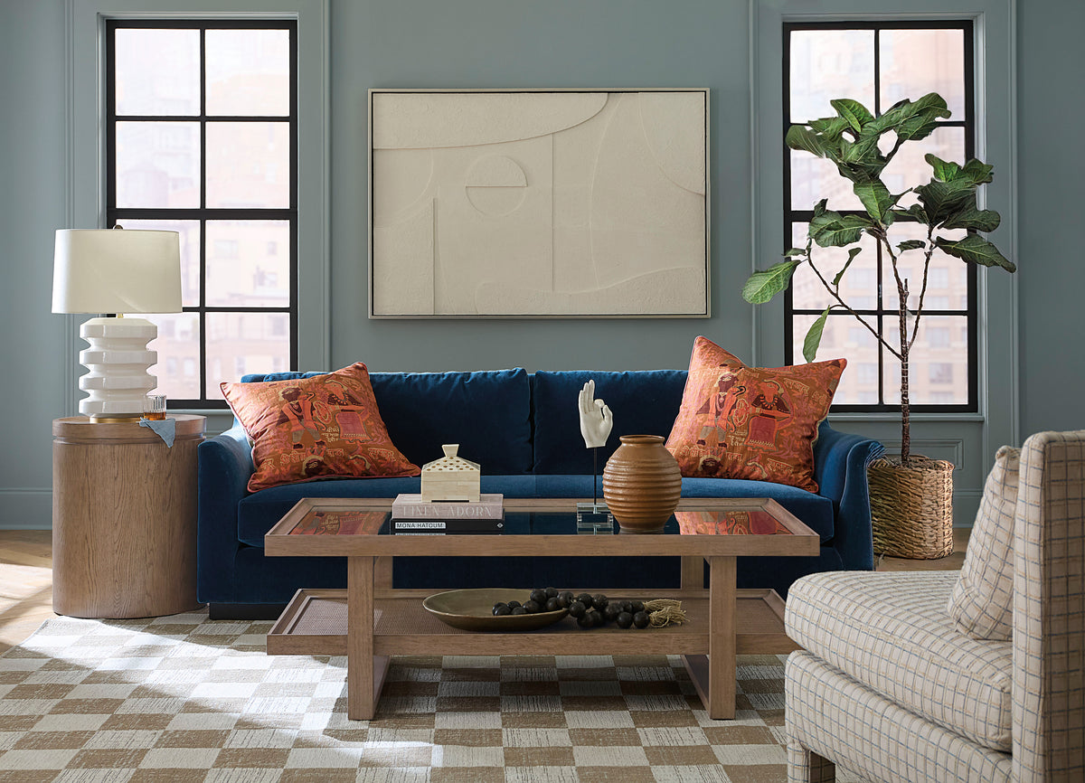 a living room with a blue couch and a coffee table