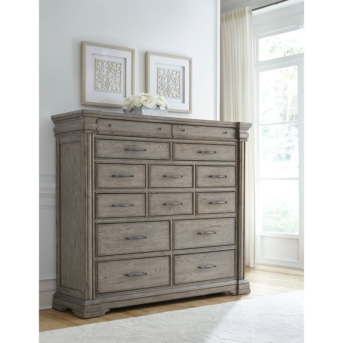a dresser with drawers and a white rug