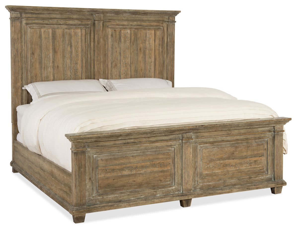 a bed with a white blanket and pillows