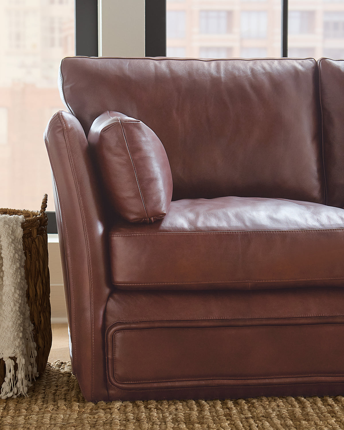 a brown leather couch in a room
